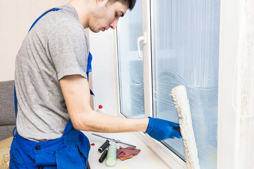 Squeegee cleaning a window