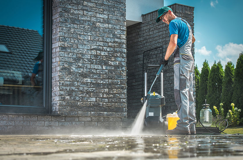 Pressure washing concrete patio