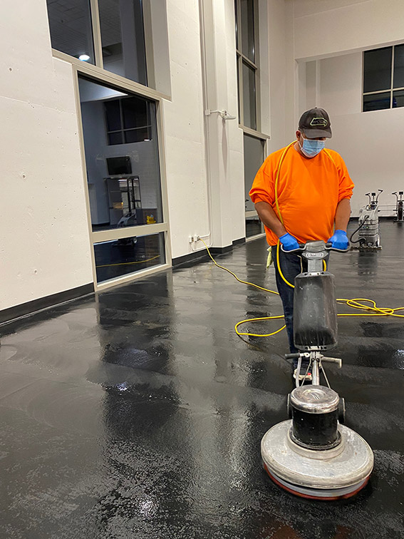 Machine scrubbing of a heavily soiled floor.