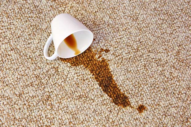 Bad coffee stain on dirty carpet